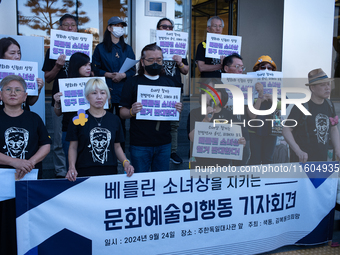 Artists and cultural figures hold a press conference in front of the German Embassy, protesting against the removal of the Peace Statue in B...