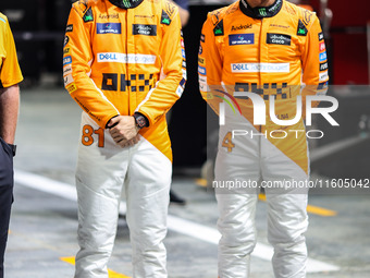 Oscar Piastri of McLaren F1 Team MCL38 and Lando Norris of McLaren F1 Team MCL38 pose for a portrait during the Formula 1 Singapore Grand Pr...