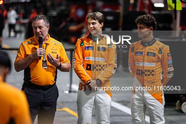 Zak Brown, Team Principal of McLaren F1 Team, Oscar Piastri of McLaren F1 Team MCL38, and Lando Norris of McLaren F1 Team MCL38 pose for a p...