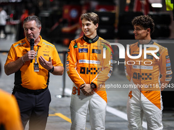 Zak Brown, Team Principal of McLaren F1 Team, Oscar Piastri of McLaren F1 Team MCL38, and Lando Norris of McLaren F1 Team MCL38 pose for a p...