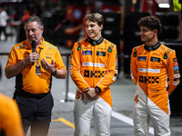 Zak Brown, Team Principal of McLaren F1 Team, Oscar Piastri of McLaren F1 Team MCL38, and Lando Norris of McLaren F1 Team MCL38 pose for a p...