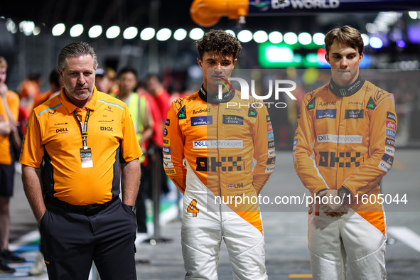 Zak Brown, CEO of McLaren F1 Team, Oscar Piastri of McLaren F1 Team MCL38, and Lando Norris of McLaren F1 Team MCL38, pose for a portrait du...