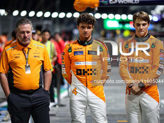 Zak Brown, CEO of McLaren F1 Team, Oscar Piastri of McLaren F1 Team MCL38, and Lando Norris of McLaren F1 Team MCL38, pose for a portrait du...