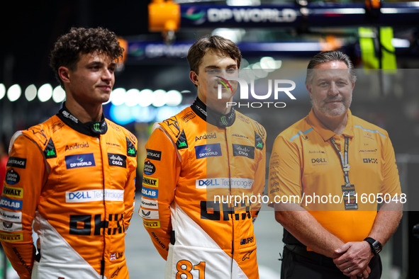 Zak Brown, CEO of McLaren F1 Team, Oscar Piastri of McLaren F1 Team MCL38, and Lando Norris of McLaren F1 Team MCL38, pose for a portrait du...