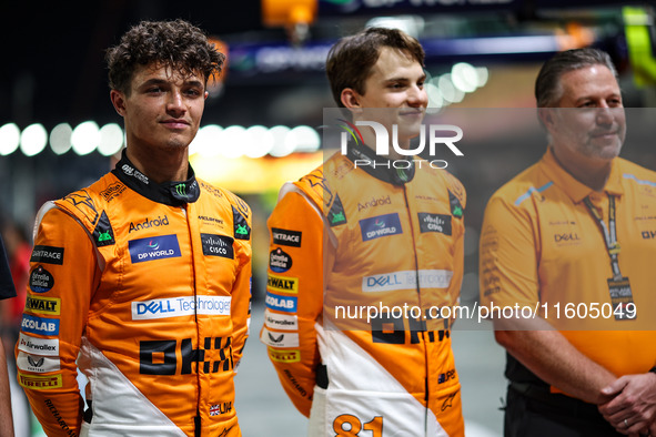 Zak Brown, CEO of McLaren F1 Team, Oscar Piastri of McLaren F1 Team MCL38, and Lando Norris of McLaren F1 Team MCL38, pose for a portrait du...