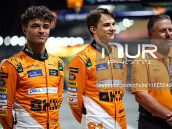 Zak Brown, CEO of McLaren F1 Team, Oscar Piastri of McLaren F1 Team MCL38, and Lando Norris of McLaren F1 Team MCL38, pose for a portrait du...