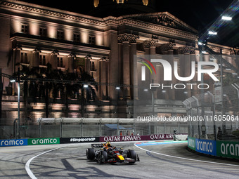 Sergio Perez of Red Bull Racing RB20 competes during the Formula 1 Singapore Grand Prix 2024 on the Marina Bay Circuit in Singapore, from Se...