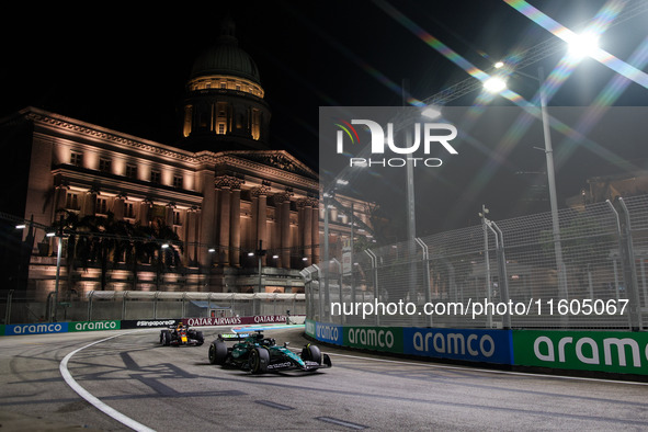 Lance Stroll of Aston Martin F1 Team AMR24 competes during the Formula 1 Singapore Grand Prix 2024 on the Marina Bay Circuit in Singapore, f...