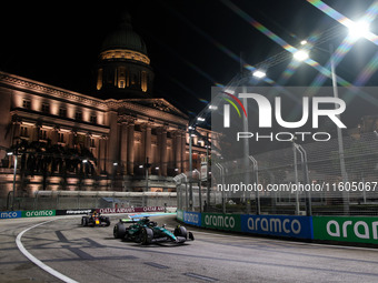 Lance Stroll of Aston Martin F1 Team AMR24 competes during the Formula 1 Singapore Grand Prix 2024 on the Marina Bay Circuit in Singapore, f...