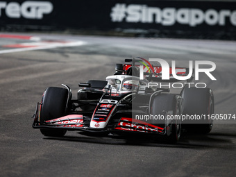 Kevin Magnussen of Haas F1 Team VF-24 Ferrari competes during the Formula 1 Singapore Grand Prix 2024 on the Marina Bay Circuit in Singapore...