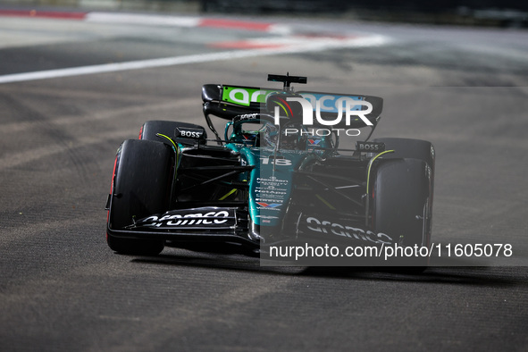 Lance Stroll of Aston Martin F1 Team AMR24 competes during the Formula 1 Singapore Grand Prix 2024 on the Marina Bay Circuit in Singapore, f...