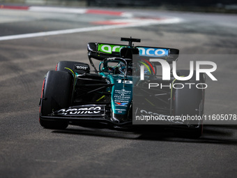 Lance Stroll of Aston Martin F1 Team AMR24 competes during the Formula 1 Singapore Grand Prix 2024 on the Marina Bay Circuit in Singapore, f...