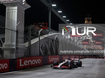 Kevin Magnussen of Haas F1 Team VF-24 Ferrari competes during the Formula 1 Singapore Grand Prix 2024 on the Marina Bay Circuit in Singapore...