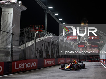 Sergio Perez of Red Bull Racing RB20 competes during the Formula 1 Singapore Grand Prix 2024 on the Marina Bay Circuit in Singapore, from Se...