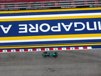 Fernando Alonso of the Aston Martin F1 Team AMR24 competes during the Formula 1 Singapore Grand Prix 2024 on the Marina Bay Circuit in Singa...