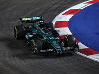 Fernando Alonso of the Aston Martin F1 Team AMR24 competes during the Formula 1 Singapore Grand Prix 2024 on the Marina Bay Circuit in Singa...