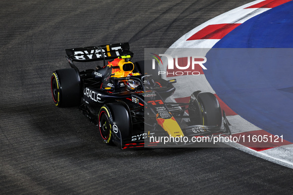 Sergio Perez of Red Bull Racing RB20 competes during the Formula 1 Singapore Grand Prix 2024 on the Marina Bay Circuit in Singapore, from Se...