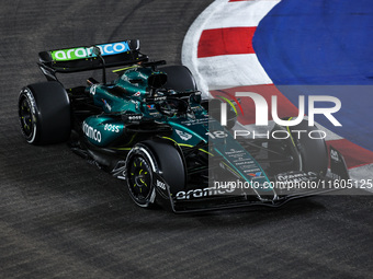 Lance Stroll of Aston Martin F1 Team AMR24 competes during the Formula 1 Singapore Grand Prix 2024 on the Marina Bay Circuit in Singapore, f...