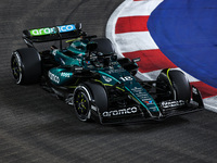 Lance Stroll of Aston Martin F1 Team AMR24 competes during the Formula 1 Singapore Grand Prix 2024 on the Marina Bay Circuit in Singapore, f...