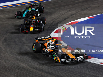 Lando Norris of McLaren F1 Team MCL38, Max Verstappen of Red Bull Racing RB20, and Lewis Hamilton of Mercedes AMG F1 Team W15 are in action...