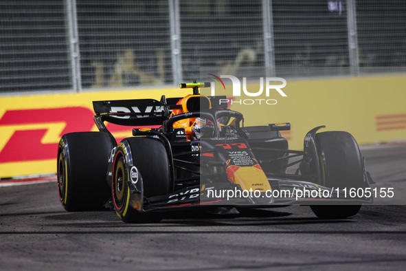 Sergio Perez of Red Bull Racing RB20 competes during the Formula 1 Singapore Grand Prix 2024 on the Marina Bay Circuit in Singapore, from Se...