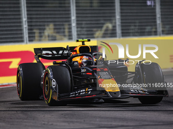 Sergio Perez of Red Bull Racing RB20 competes during the Formula 1 Singapore Grand Prix 2024 on the Marina Bay Circuit in Singapore, from Se...