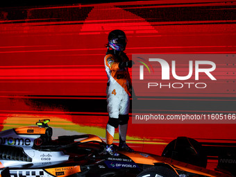 Lando Norris of the McLaren F1 Team celebrates his victory during the Formula 1 Singapore Grand Prix on the Marina Bay Circuit in Singapore,...