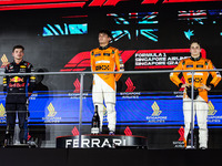 Lando Norris of McLaren F1 Team MCL38, Max Verstappen of Red Bull Racing RB20, and Oscar Piastri of McLaren F1 Team MCL38, during the Formul...