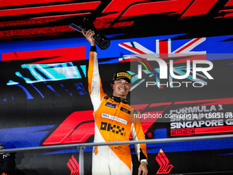 Lando Norris of the McLaren F1 Team celebrates his victory during the Formula 1 Singapore Grand Prix on the Marina Bay Circuit in Singapore,...