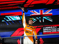 Lando Norris of the McLaren F1 Team celebrates his victory during the Formula 1 Singapore Grand Prix on the Marina Bay Circuit in Singapore,...