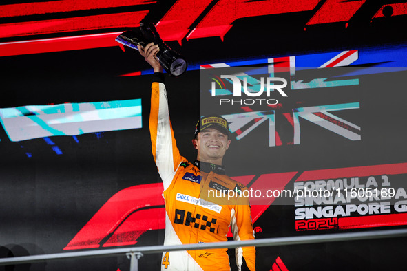 Lando Norris of the McLaren F1 Team celebrates his victory during the Formula 1 Singapore Grand Prix on the Marina Bay Circuit in Singapore,...