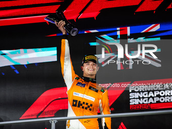 Lando Norris of the McLaren F1 Team celebrates his victory during the Formula 1 Singapore Grand Prix on the Marina Bay Circuit in Singapore,...