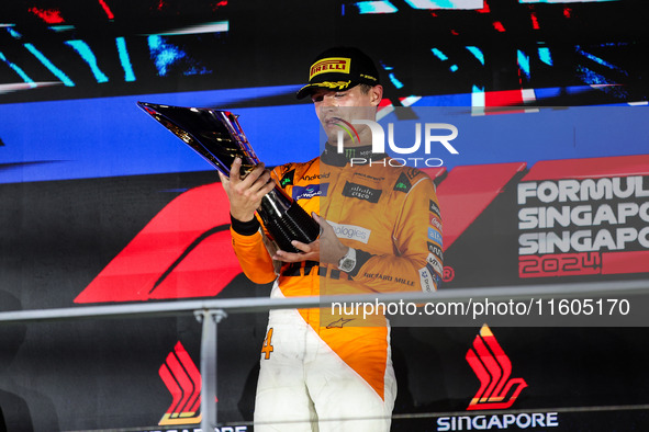 Lando Norris of the McLaren F1 Team celebrates his victory during the Formula 1 Singapore Grand Prix on the Marina Bay Circuit in Singapore,...