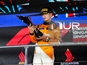 Lando Norris of the McLaren F1 Team celebrates his victory during the Formula 1 Singapore Grand Prix on the Marina Bay Circuit in Singapore,...