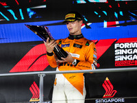 Lando Norris of the McLaren F1 Team celebrates his victory during the Formula 1 Singapore Grand Prix on the Marina Bay Circuit in Singapore,...