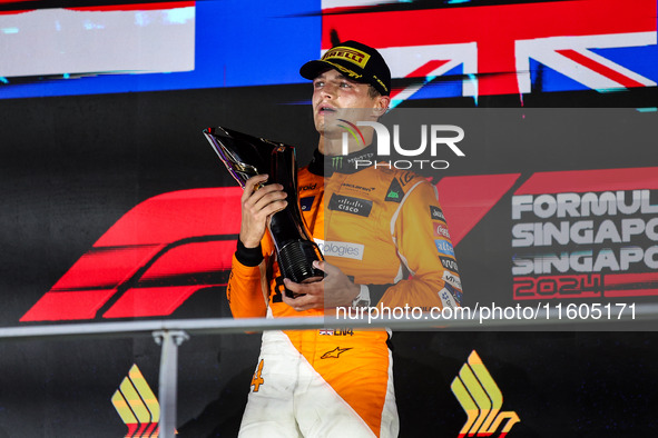 Lando Norris of the McLaren F1 Team celebrates his victory during the Formula 1 Singapore Grand Prix on the Marina Bay Circuit in Singapore,...