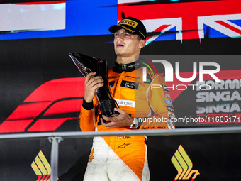 Lando Norris of the McLaren F1 Team celebrates his victory during the Formula 1 Singapore Grand Prix on the Marina Bay Circuit in Singapore,...