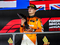 Lando Norris of the McLaren F1 Team celebrates his victory during the Formula 1 Singapore Grand Prix on the Marina Bay Circuit in Singapore,...