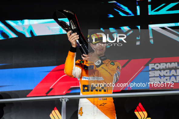 Lando Norris of the McLaren F1 Team celebrates his victory during the Formula 1 Singapore Grand Prix on the Marina Bay Circuit in Singapore,...