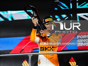 Lando Norris of the McLaren F1 Team celebrates his victory during the Formula 1 Singapore Grand Prix on the Marina Bay Circuit in Singapore,...