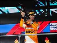 Lando Norris of the McLaren F1 Team celebrates his victory during the Formula 1 Singapore Grand Prix on the Marina Bay Circuit in Singapore,...