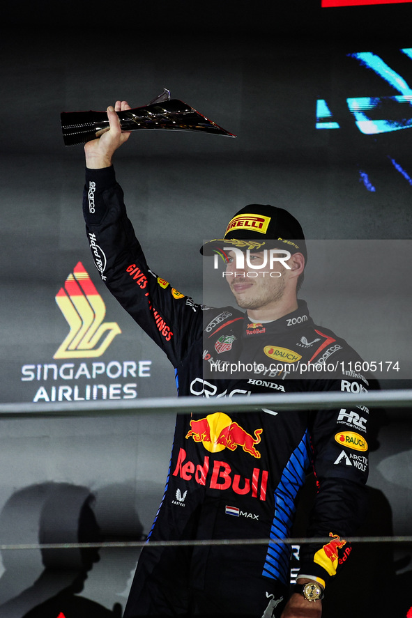 Max Verstappen of Red Bull Racing RB20 celebrates his podium during the Formula 1 Singapore Grand Prix 2024 on the Marina Bay Circuit in Sin...