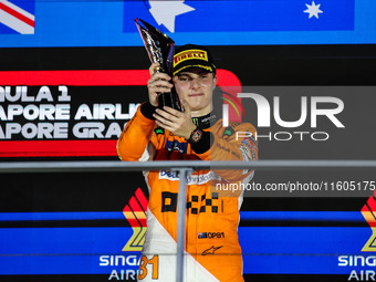 Oscar Piastri of McLaren F1 Team MCL38 celebrates his podium during the Formula 1 Singapore Grand Prix 2024 on the Marina Bay Circuit in Sin...