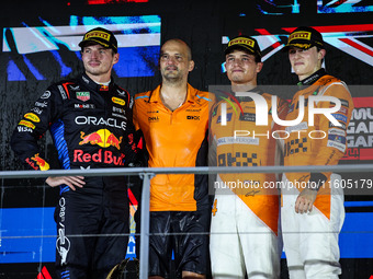 Max Verstappen of Red Bull Racing RB20, Lando Norris of McLaren F1 Team, and Oscar Piastri of McLaren F1 Team during the Formula 1 Singapore...