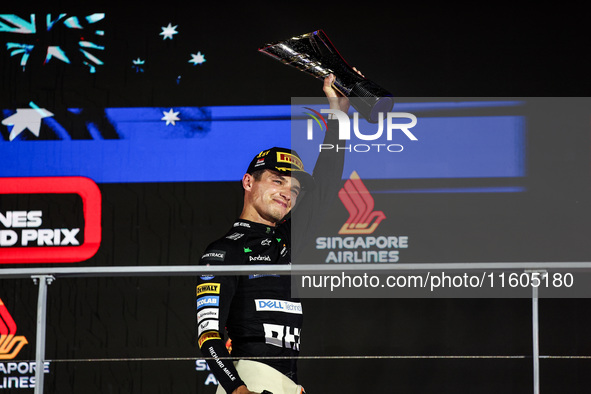 Lando Norris of the McLaren F1 Team MCL38 stands on the podium during the Formula 1 Singapore Grand Prix in Singapore, on September 19 to 22...