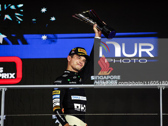 Lando Norris of the McLaren F1 Team MCL38 stands on the podium during the Formula 1 Singapore Grand Prix in Singapore, on September 19 to 22...