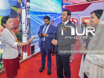 The Deputy Minister of Economic Affairs of the Ministry of Economic Affairs of the United Arab Emirates (UAE) visits the exhibition hall at...