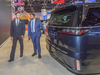 The Undersecretary of Economic Affairs of the Ministry of Economic Affairs of the United Arab Emirates (1st L) visits the Dongfeng Motor Exh...