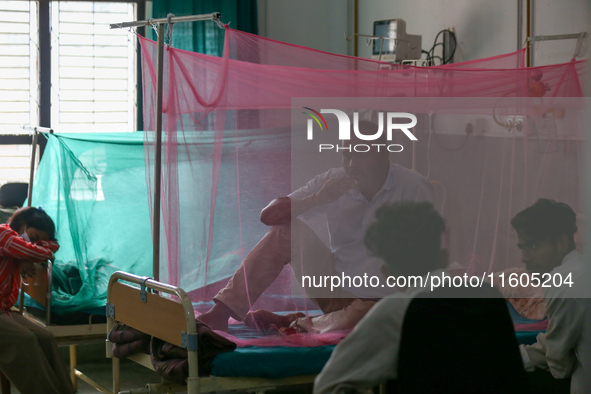 A dengue-infected patient undergoes treatment at Sukraraj Tropical and Infectious Disease Hospital in Kathmandu, Nepal, on September 24, 202...