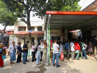 People stand in a queue to take tickets for check-up at the counter of Sukraraj Tropical and Infectious Disease Hospital in Kathmandu, Nepal...